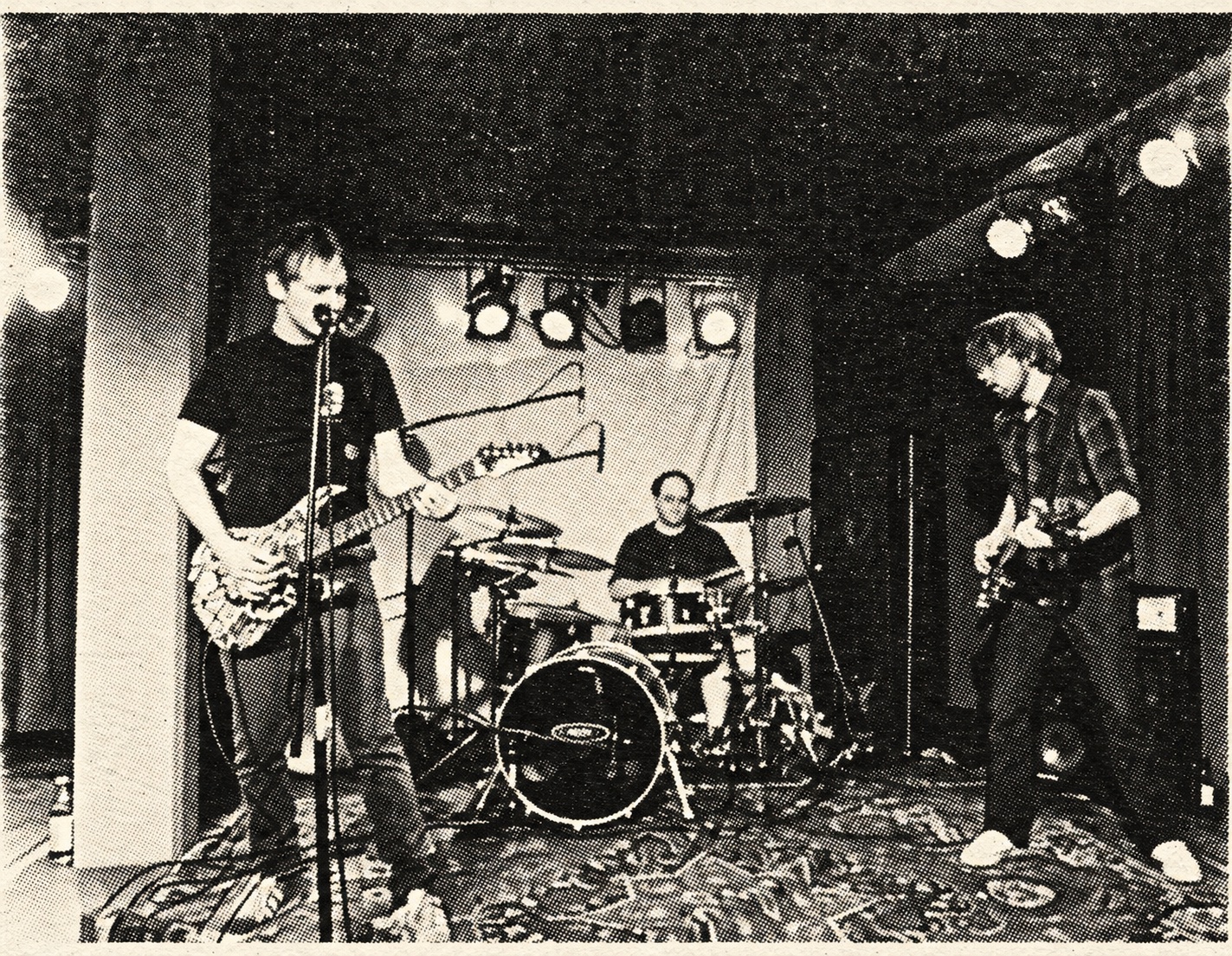 Jumpin' Juice on a small club stage — black-and-white halftone