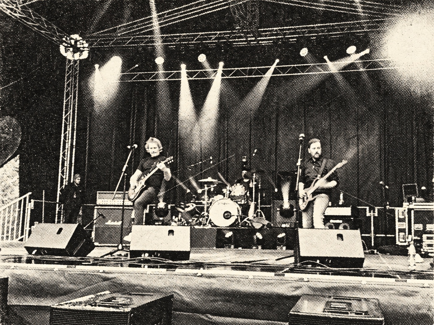 Jumpin' Juice on an outdoor festival stage — black-and-white halftone