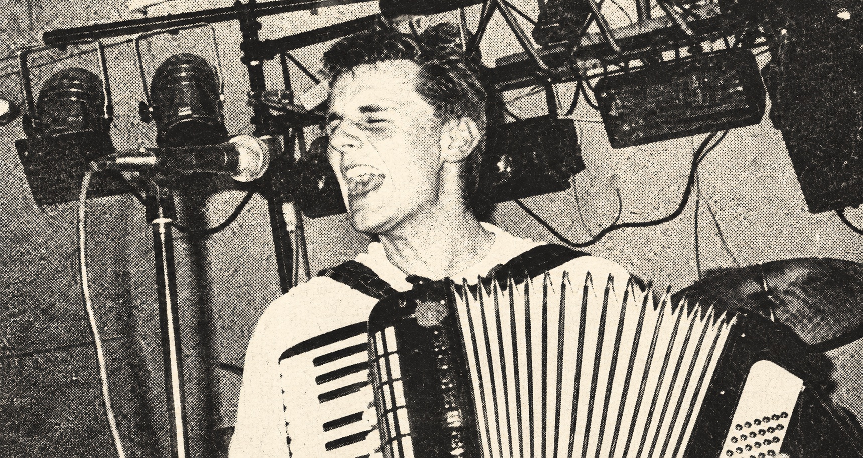 Hans Stübinger singing and playing accordion — black-and-white halftone